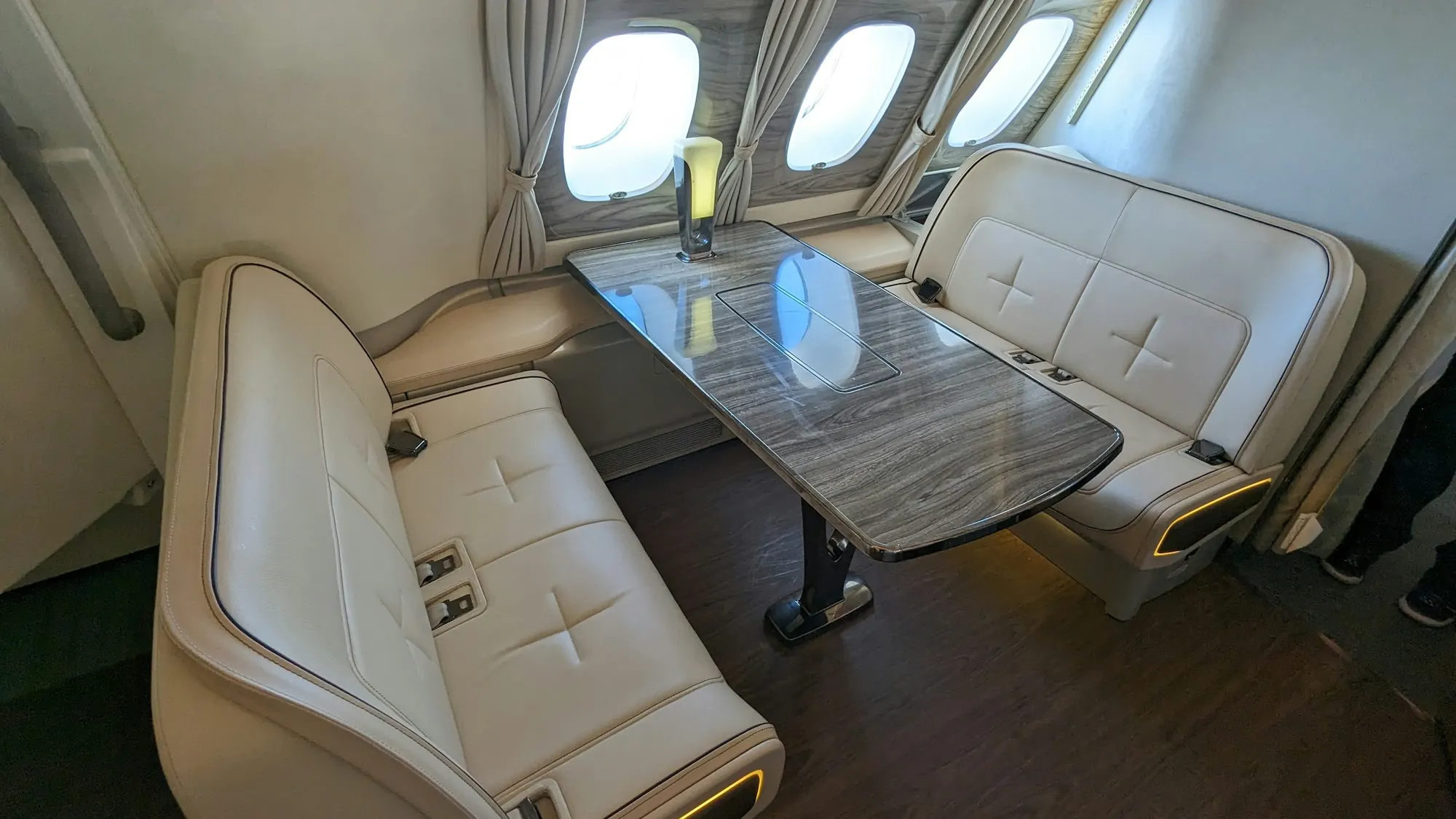 Club seating around a table in a private jet cabin