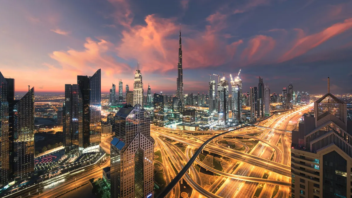 City highways and towers lit up at night