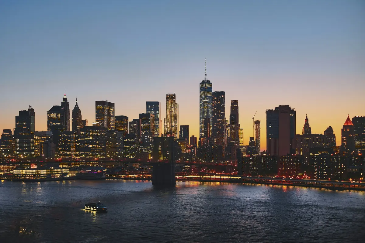 Manhattan skyline at dusk seen across the river